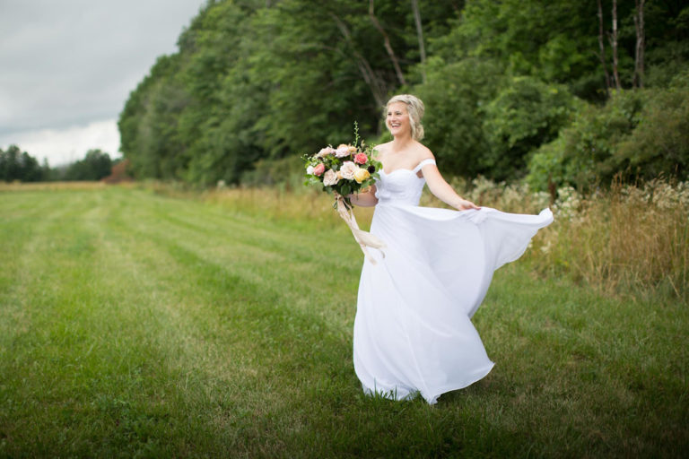 The bride twirling in the meadow