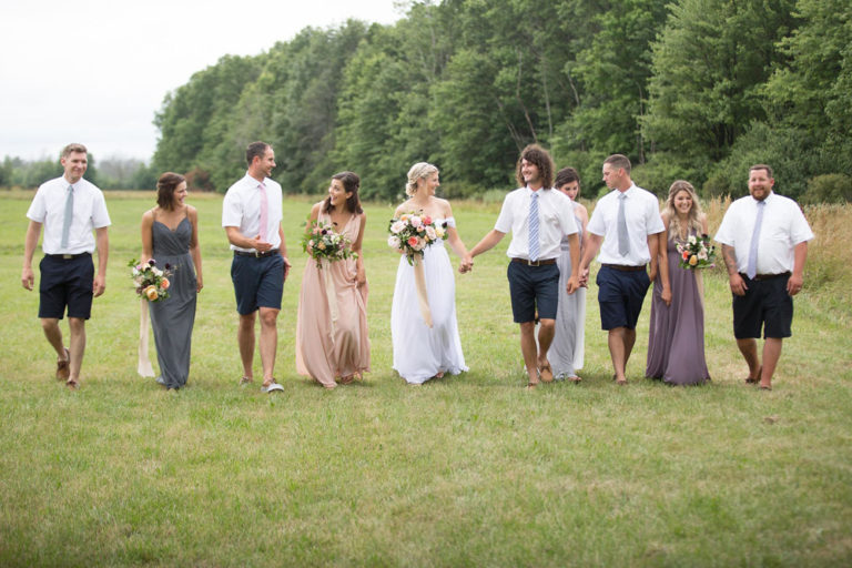 The wedding party lined up in the field