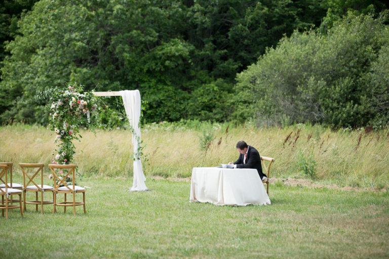 The ceremony arch and signing table in the meadow