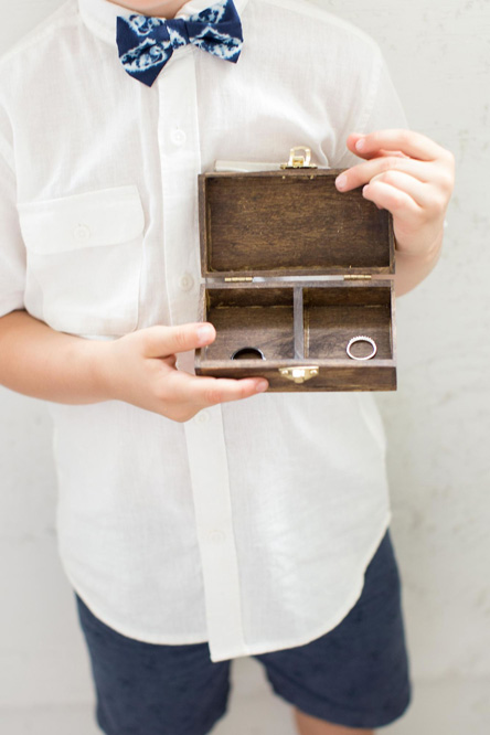Hands holding a wooden ring box