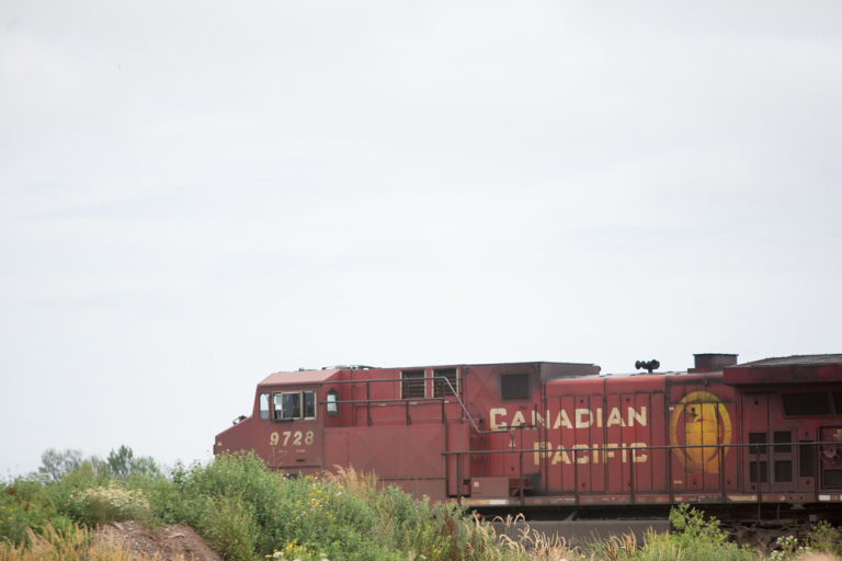 A train passing in the distance beyond the field