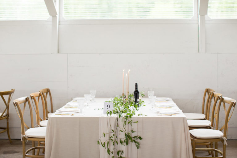 Long tables set in the barn