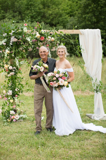 The bride and groom with the bouquet