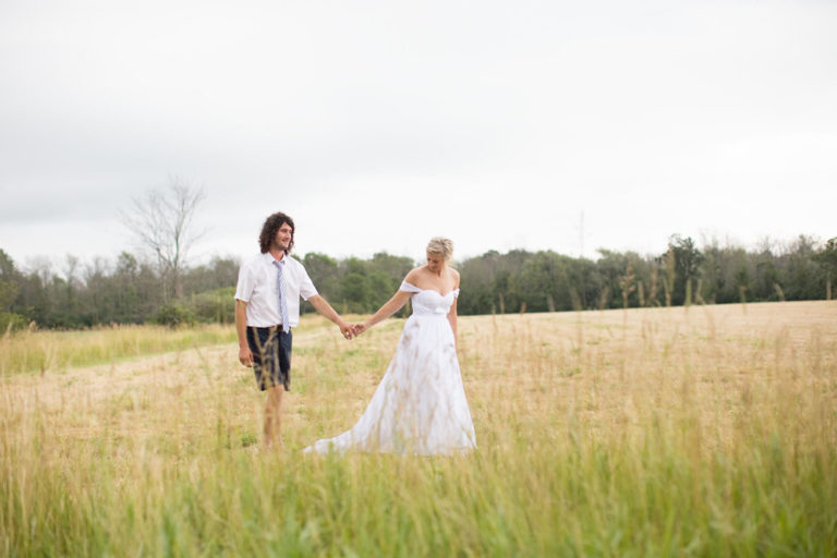 The bride and groom in the golden field